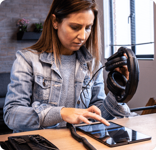 Female conducting hearing self-assessment